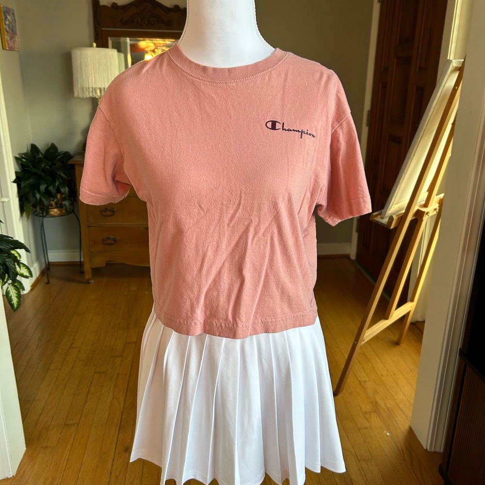Champion Coral Tee with Logo and White Pleated Skirt